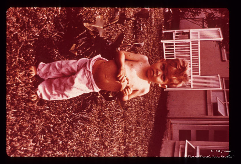 Child and statue with typical stance. Costa Rica.