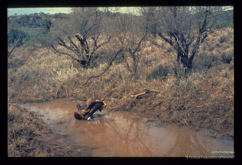 A man drinking polluted water. Ethiopia.